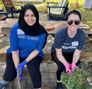 Volunteers from State Street Bank working at the Cushing Center Greenhouse