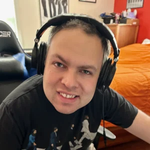 Cushing adult listening to music with headphones