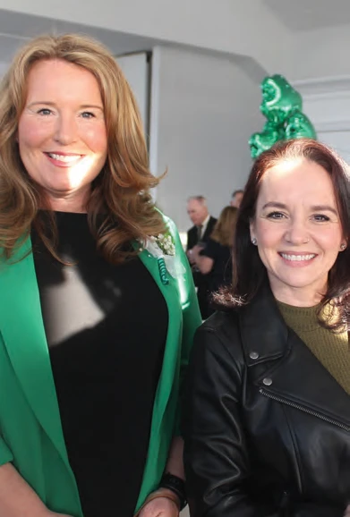 Michelle Markowitz and Tammie Frye wearing green