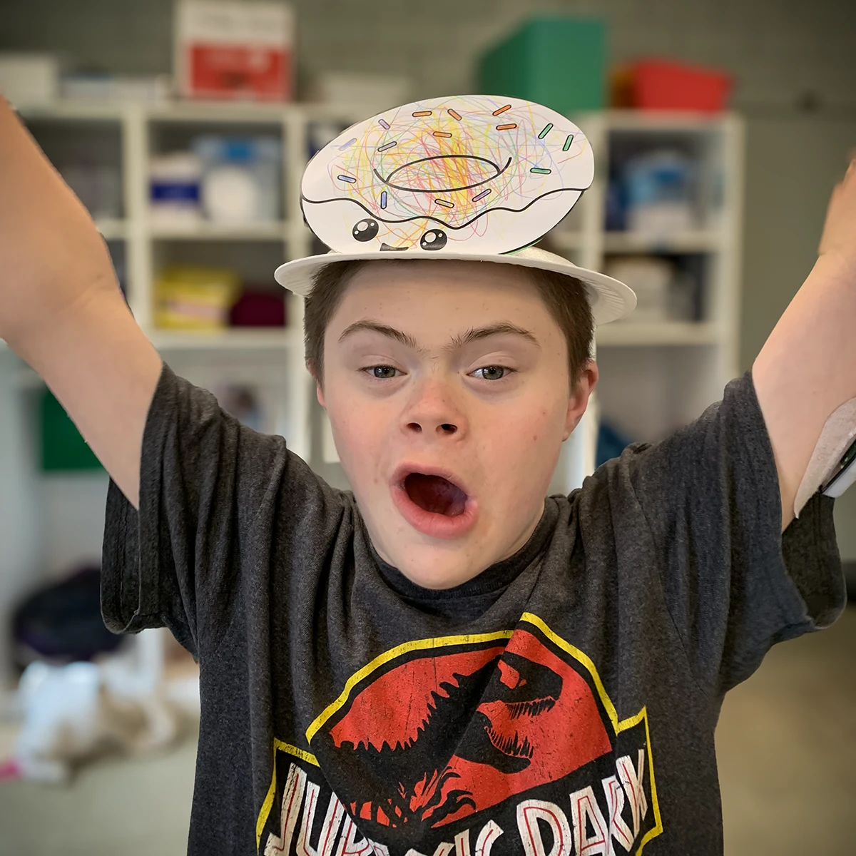 Cushing student wearing a fun hat and posing for the camera