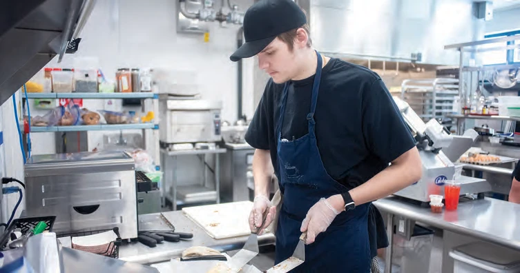 Owen Dillon plating a quesadilla at the Cushing Café