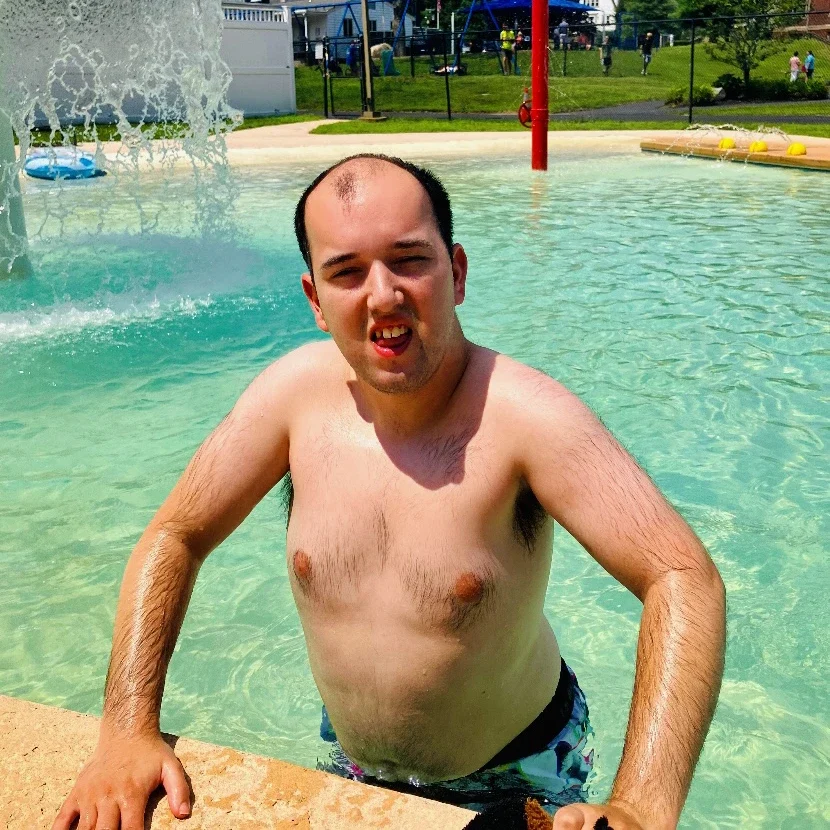 Cushing adult having fun in the pool